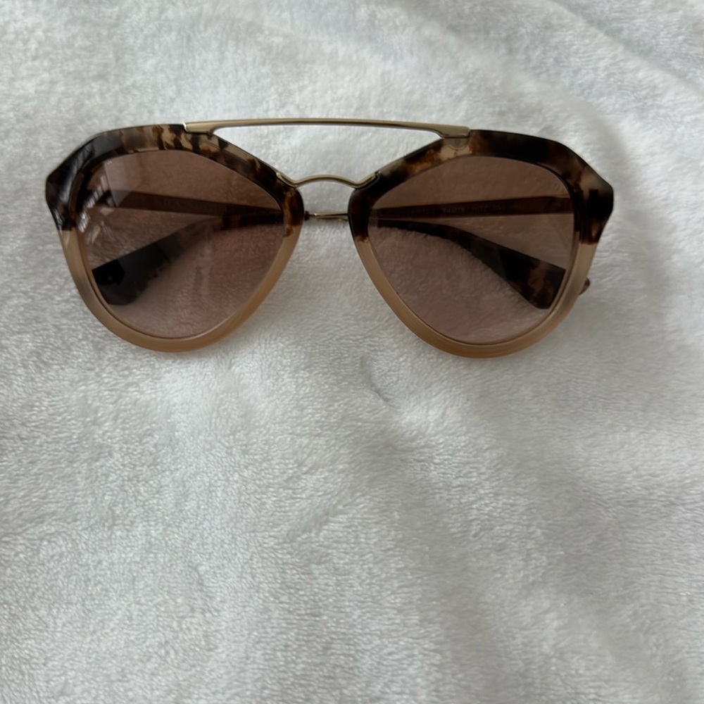Prada Sunglasses. Extremely light weight, with gold accent
